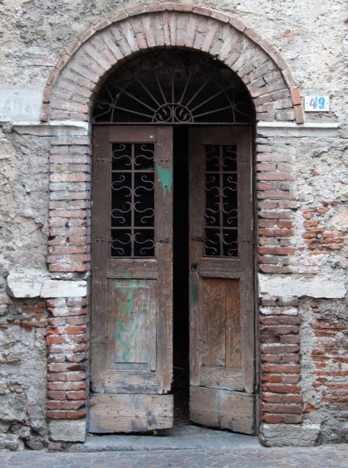 old doorway patched doors dilapidated