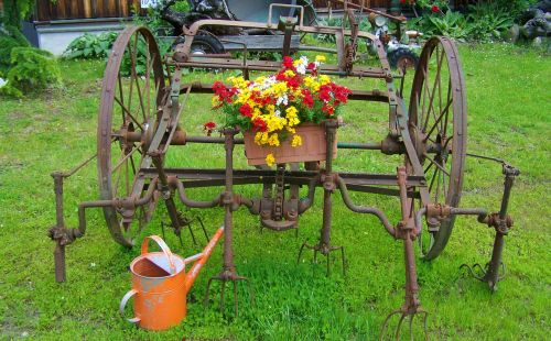 old farm tool iron garden decor old watering cans