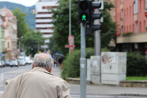 old man crossing street traffic lights old
