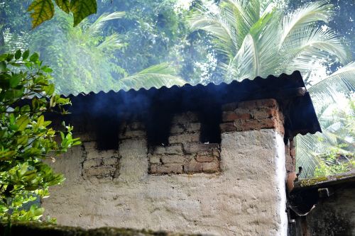 old village house chimney smoke