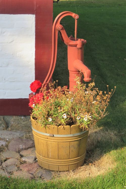 old water pump painted maroon no longer functional