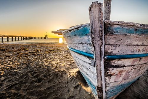 old wooden boat at sunrise wooden boat fishing boat