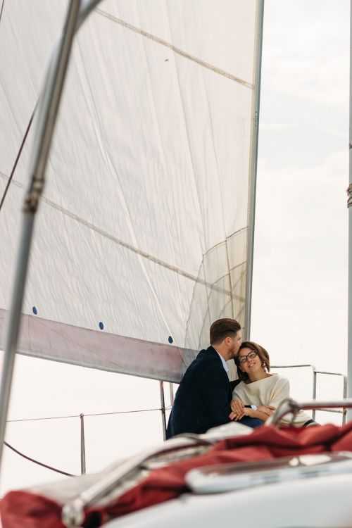 on a yacht sweethearts kiss