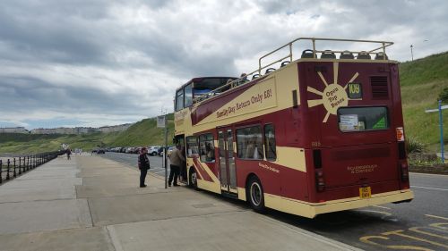 open top bus beach seaside