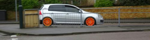 Orange Wheels Car On The Road