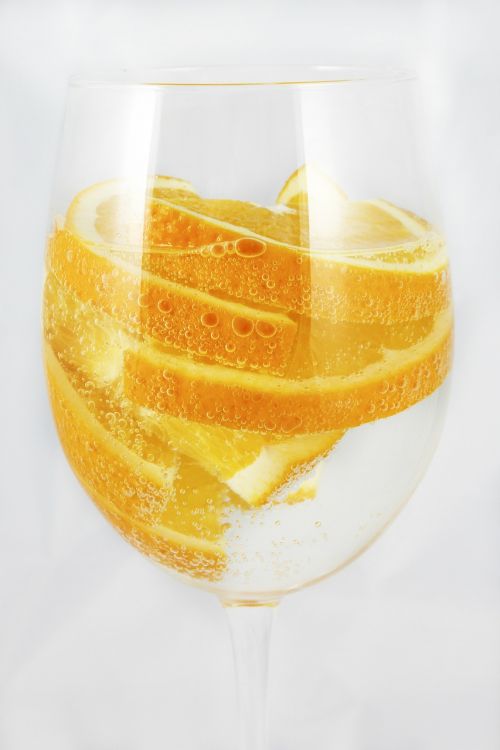 oranges sparkling water a glass of