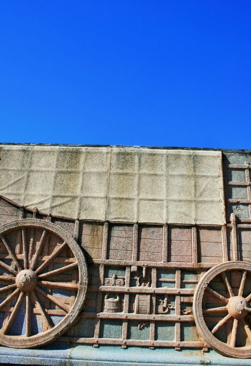 Ox Wagon Relief Against Blue Sky