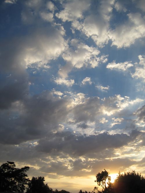 Pale Sunset And White Clouds