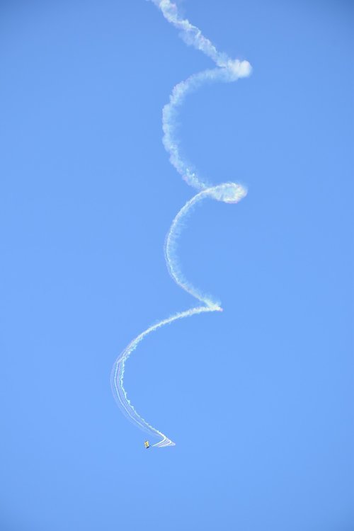 parachutist  smoke trail  sky