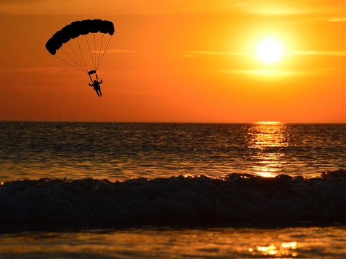paraglider  sunset  paragliding