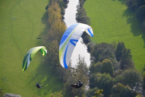paragliders practice in free flight para motor