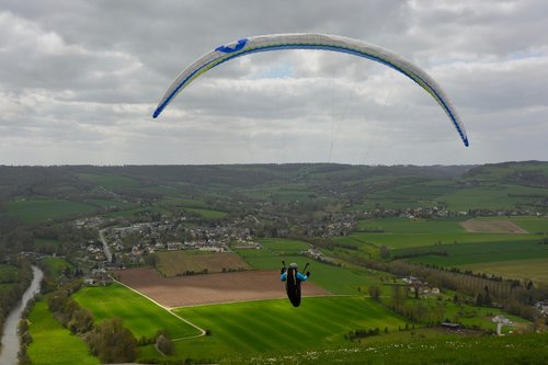 paragliders  free flight  panoramic view blue sky cloudy