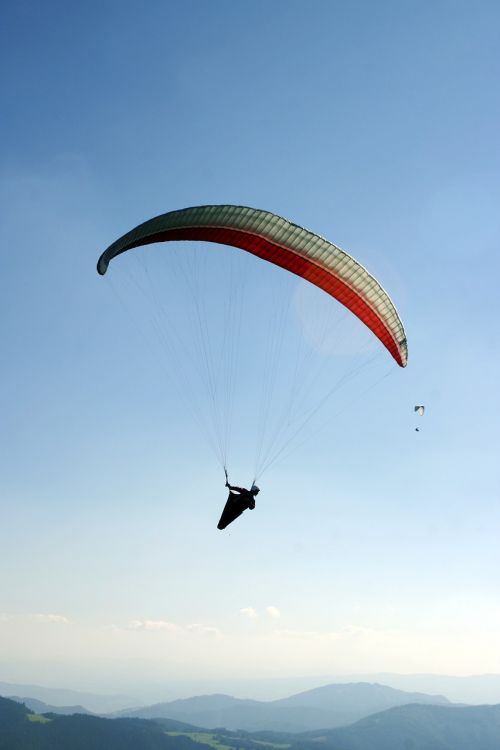 paragliding a parachute the sky