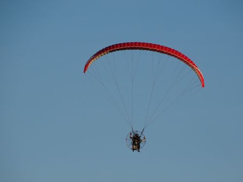 paragliding blue sky parachute