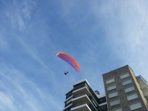 paragliding sky buildings