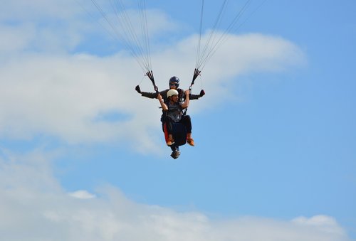 paragliding  tandem paragliding  blue sky
