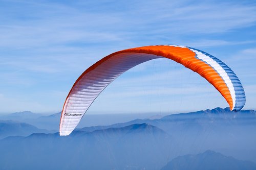 paragliding  sky  mountains