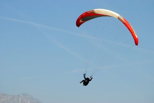paragliding blue sky parachute