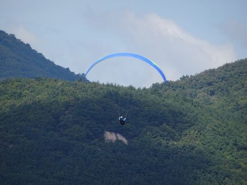 paragliding rainbow nature