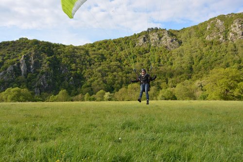 paragliding landing  paraglider arises  fly