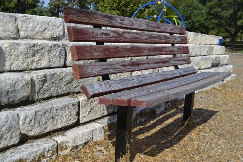 park bench brick wall clean