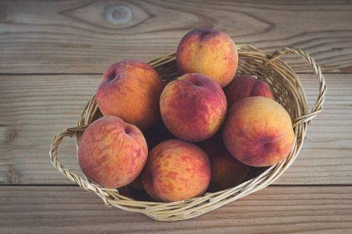 peach peaches in the basket shopping cart
