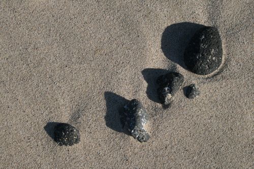 pebbles sand sea