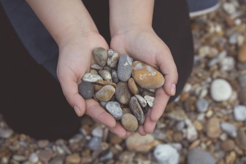 pebbles rocks hands