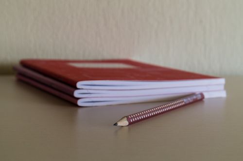 pencil notebook desk