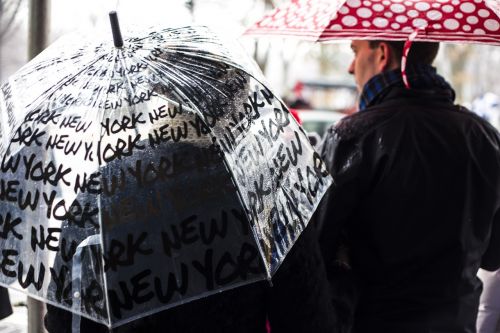 people umbrellas standing