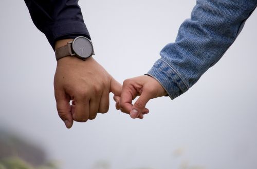 people couple holding hands