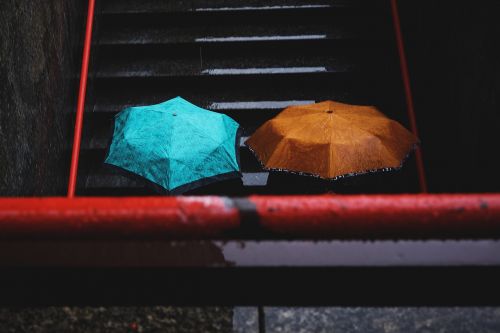 people umbrella stairs