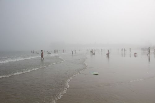 people beach foggy