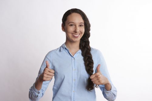 person thumbs up smiling