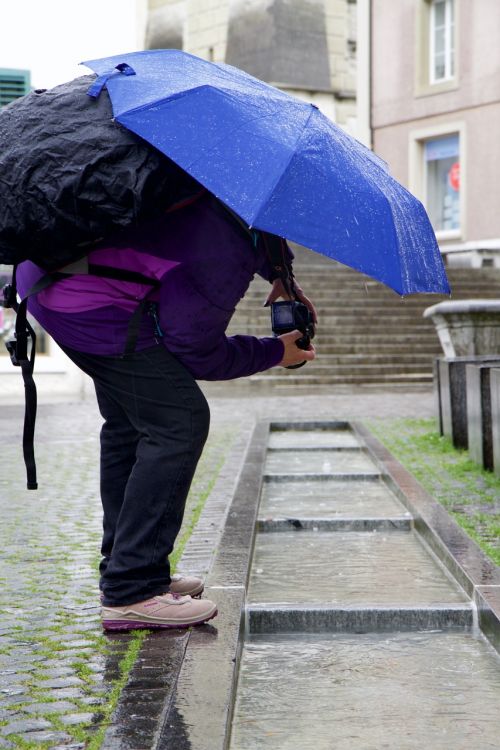 photographer umbrella water