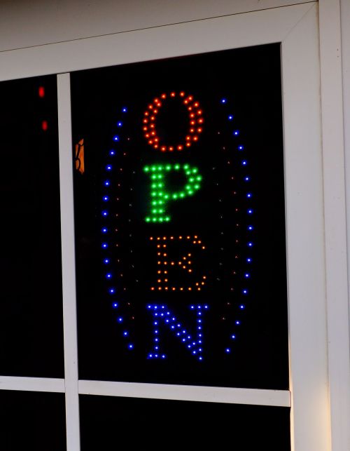 pizzeria open neon sign