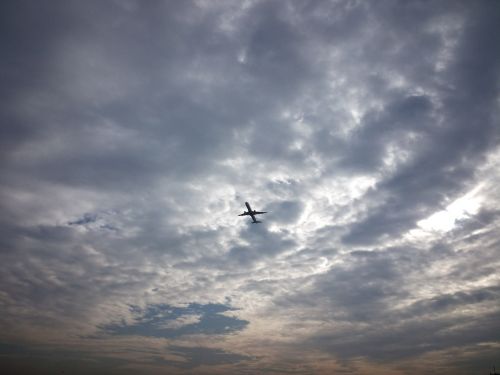 plane take off cloudy sky