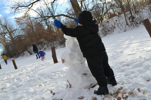 playing snowman building