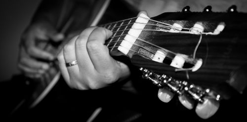 playing guitar guitar black and white