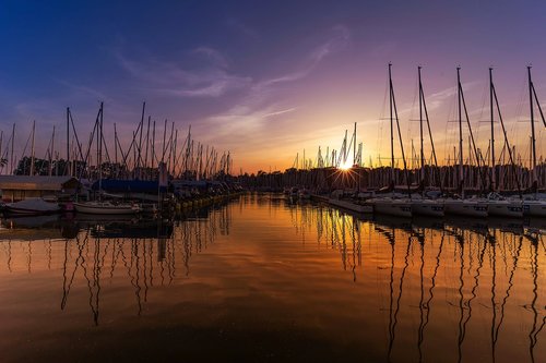 port  sunset  sailing boat