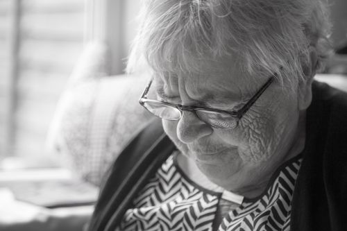 Portrait Of An Old Woman With Glass