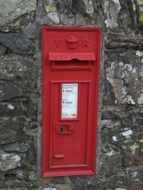 postbox stone wall