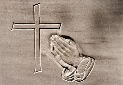 praying hands religious stone