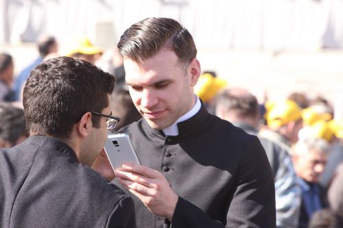 priest mobile phone human