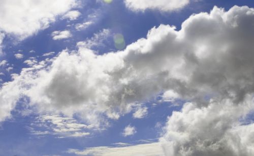 Puffy White Clouds And Blue Sky