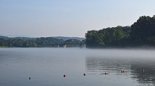 railroad bridge on foggy morning fog dawn