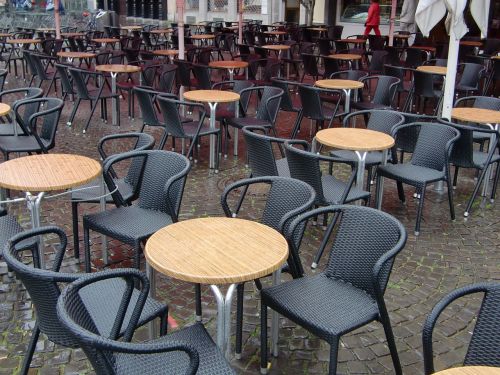 rain chairs street cafe