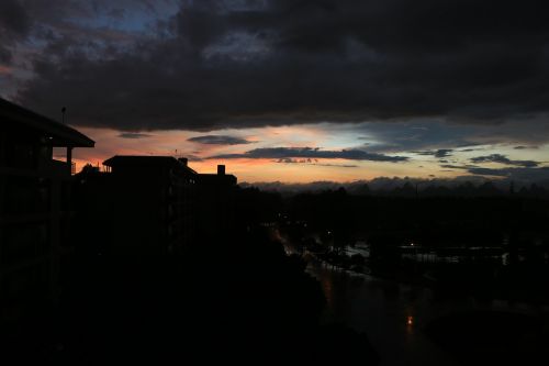 rain sunset dark clouds