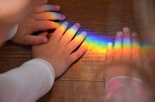 hands rainbow children