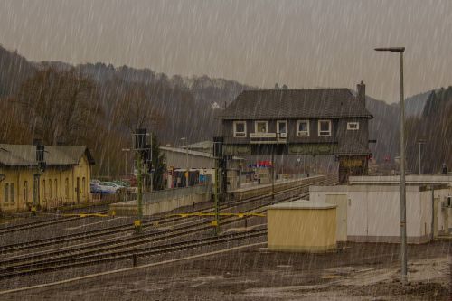 raining railway station train